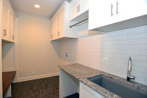 Custom Laundry Room with boot bench