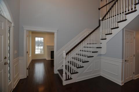 Custom stair and traditional wainscoting