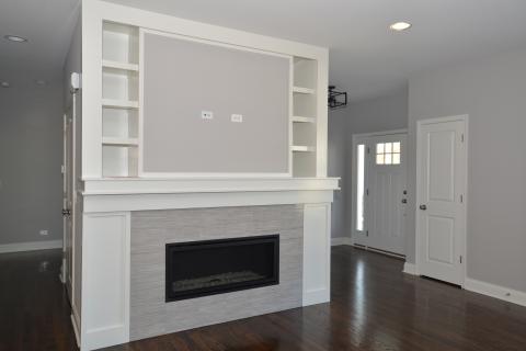 Custom fireplace surround with shelves